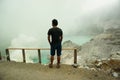 A man is enjoying the beauty of the Ijen crater